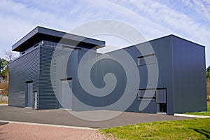 Grey modern business unit industrial building outside gray architecture