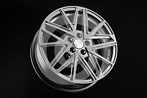 Grey multi-spoke alloy wheel on black background