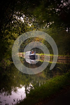 Grey narrow boat on UK canal