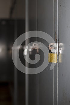 Grey neutral lockers with padlock locks for gym, dressing room, company, school for personal storage