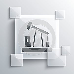 Grey Oil pump or pump jack icon isolated on grey background. Oil rig. Square glass panels. Vector