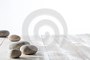 Grey pebbles for meditation, mindfulness, mineral spa or white emptiness photo
