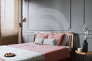 Grey and pink woman`s bedroom