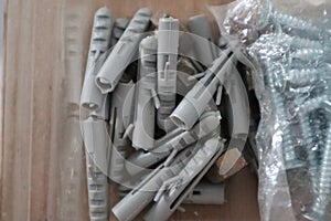 Grey Plastic Dowels Wall Mount Anchor in the Storage Box