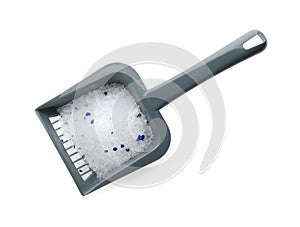 Grey plastic scoop with cat litter isolated on white, top view