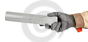 Grey plastic sewer pipe in worker hand in black protective glove and brown uniform isolated on white background