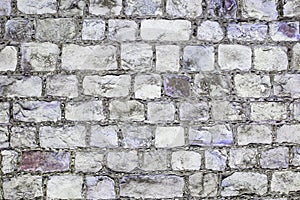 Grey and purple grunge brick wall background