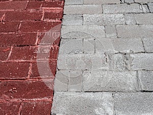 Grey and red concrete brick wall surface