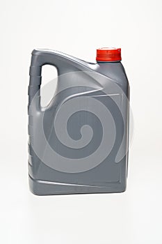 grey with a red lid canister with machine oil on a white background.