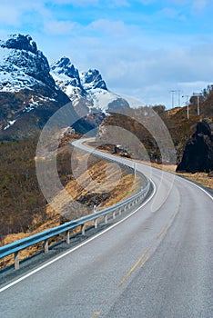 Grey road in Norvegian mountains photo