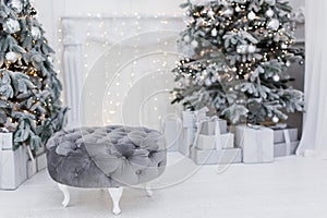 Grey round pouf near Christmas tree