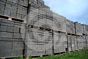 Grey slag stones in stacks at outdoor construction supermarket