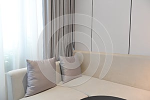 Grey sofa in modern hotel room
