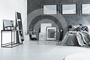 Grey sophisticated bedroom with posters