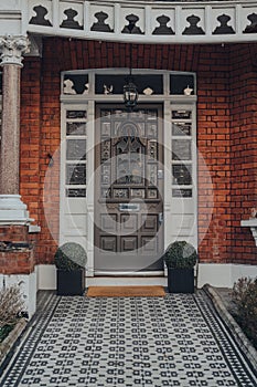 Grey stained glass wooden door of a house in London, UK