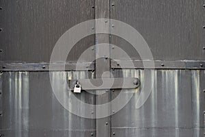 The grey steel door with padlock