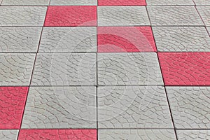 Grey stone abstract grey pattern pavement floor tile city street texture background red paint pink color structure