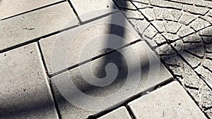 Grey stone tiled floor on a sunny street