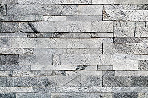 Grey stone wall texture or abstract background.