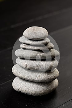 Grey Stones Balanced on the black background