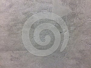 Grey textured concrete wall with rough surface
