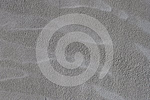 Grey textured unpainted wall plastered with cement mortar