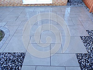 Grey tile patio in garden