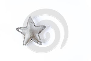 Grey toy star on white background. Decor element