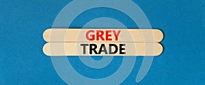 Grey trade symbol. Concept words Grey trade on wooden sticks. Beautiful blue table blue background. Business grey trade concept.