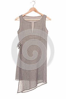 A grey tunic is on hanger.
