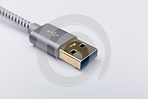 Grey USB cable on a white background