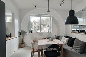 grey wall chopping board and wooden table black pillow black lantern with black white modern kitchen dining room corner