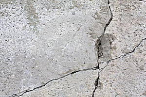 Grey wall with cracks.