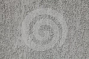 Grey wall, texture, background. Decorated surface with embossed pattern