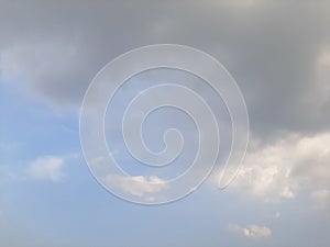 Grey and white cloud on blue sky