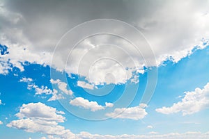 Grey and white soft clouds in the blue sky