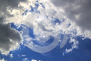 grey and white clouds on blue sky background