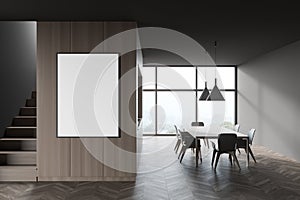 Grey and wooden dining room with stairs and poster