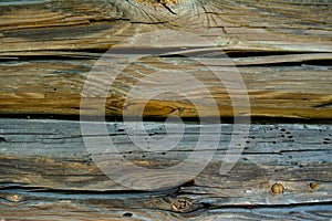 Grey wooden faded logs background with flaws photo
