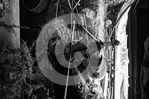 Greyscale image of an older bohemian man playing violin