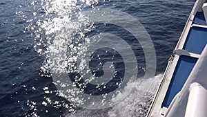 Greywater of a Fast Boat against the Sunbeams on the Sea