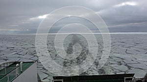 Greywater of a ship on the frozen sea surface