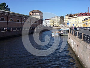 Griboyedov Canal in summer and ancient architecture in the background. Saint Petersburg.