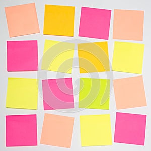 A grid of colourful blank sticky notes with copy space