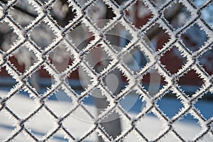 Grid covered with snow, mesh covered with frostÐ­,