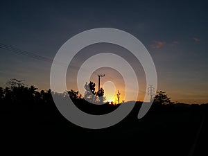 Grid electricity powerline tower sunset beautiful sky