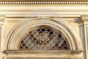 Grid of round window of Italian XVII Century church photo