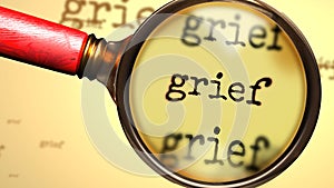 Grief - abstract concept and a magnifying glass enlarging English word Grief to symbolize studying, examining or searching for an
