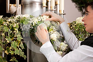 Grief - female mortician preparing urn Funeral photo