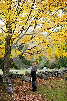 Grieving woman in cemetery